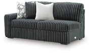 Ashley Furniture Midnight-Madness sectional sofa shown from an angled view, showcasing plush cushions and modern design.
