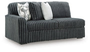 Ashley Furniture Midnight-Madness sectional sofa shown from an angled view with plush cushions and modern design.
