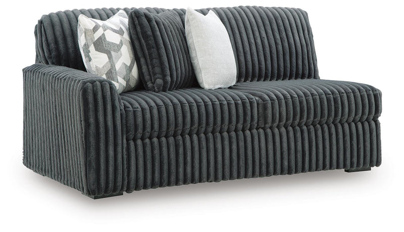 Ashley Furniture Midnight-Madness sectional sofa shown from an angled view with plush cushions and modern design.