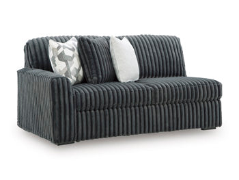 Ashley Furniture Midnight-Madness sectional sofa viewed from an angle, showcasing plush cushions and modern design.
