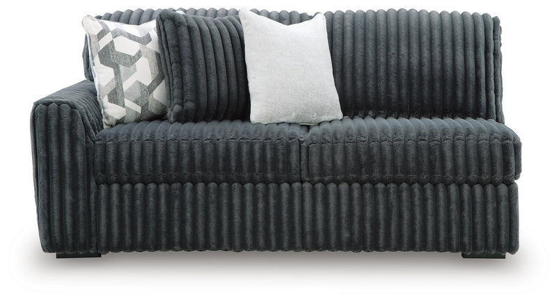 Ashley Furniture Midnight-Madness sectional with plush cushions and dark upholstery, viewed from head-on showing the sofa's detailed design.