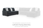 Ashley Furniture Midnight-Madness sectional sofa with dark fabric and plush cushions, shown in a modern living room setting.