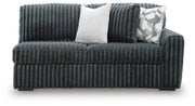 Ashley Furniture Midnight-Madness sectional showing plush fabric, modern design, and sectional configuration in a stylish living room setting.