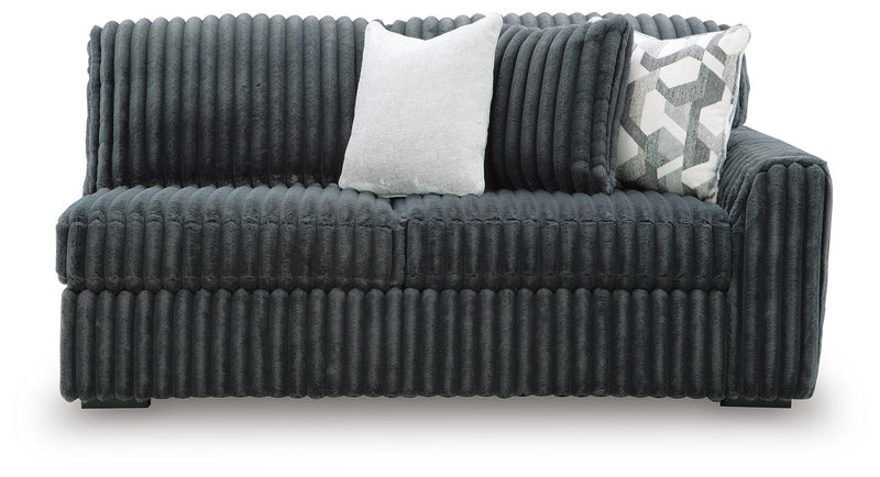 Ashley Furniture Midnight-Madness sectional showing plush fabric, modern design, and sectional configuration in a stylish living room setting.