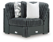 Ashley Furniture Midnight-Madness sectional with plush fabric, shown from a head-on view highlighting the sofa's modern design and cushions.