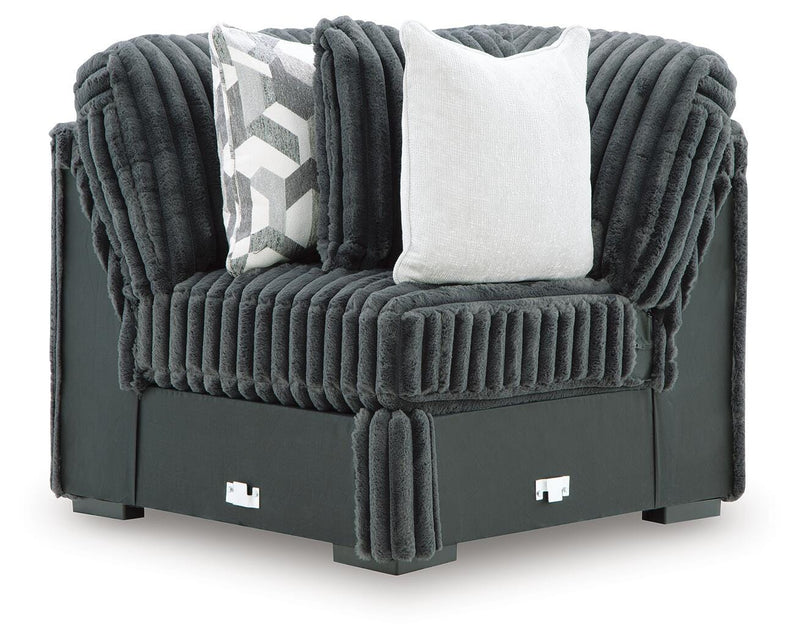 Ashley Furniture Midnight-Madness sectional with plush fabric, shown from a head-on view highlighting the sofa's modern design and cushions.