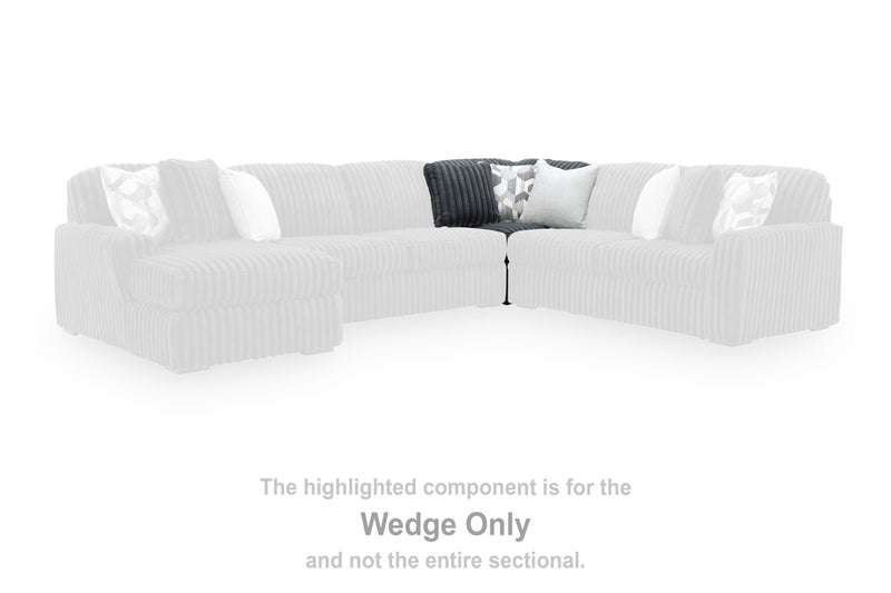 Ashley Furniture Midnight-Madness sectional sofa with dark fabric, plush cushions, and modern design in a stylish living room setting.