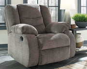 Ashley Furniture Tulen living room set featuring a sofa and armchair with neutral upholstery and modern design elements.