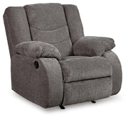 Ashley Furniture Tulen living room set with sofa and armchair in a modern design, featuring neutral fabric upholstery and wooden legs.