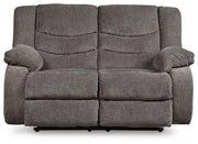 Ashley Furniture Tulen living room set with sofa and armchair in a modern design, shown in a cozy living space.