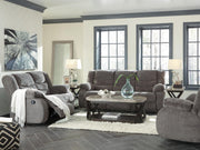 Ashley Furniture Tulen Reclining Sofa showing plush fabric, reclining seats, and wide armrests in a modern living room setting.