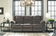 Ashley Furniture Tulen reclining sofa with plush cushions and modern design, shown in a closed position.