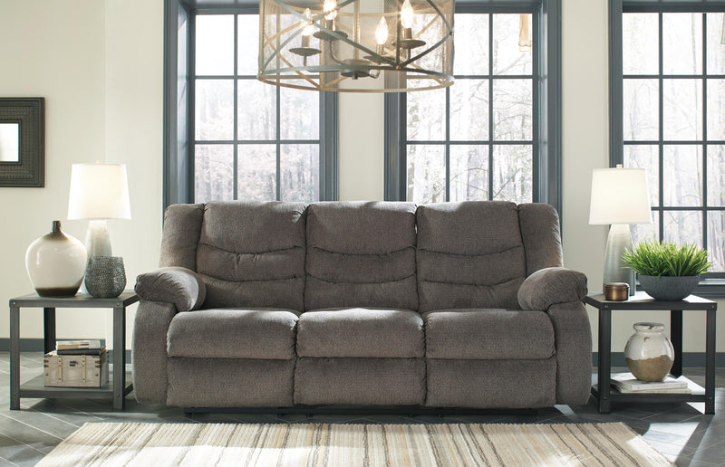 Ashley Furniture Tulen reclining sofa with plush cushions and modern design, shown in a closed position.