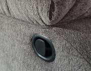Close-up of the Ashley Furniture Tulen Recliner showcasing plush fabric, padded armrests, and reclining mechanism.