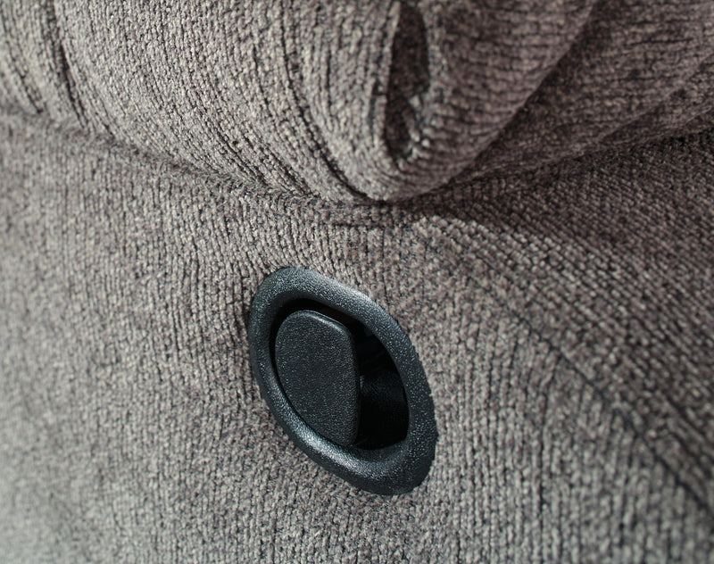 Close-up of the Ashley Furniture Tulen Recliner showcasing plush fabric, padded armrests, and reclining mechanism.