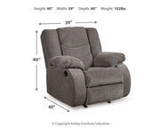 Ashley Furniture Tulen recliner in soft beige fabric with plush cushioning and wooden base, ideal for living room seating.