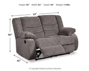 Ashley Furniture Tulen living room set with sofa and armchair in a modern design, featuring neutral upholstery and stylish cushions.