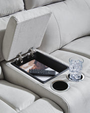 Ashley Furniture Social Pointe reclining sectional with storage console, showing close-up of the console and plush fabric.