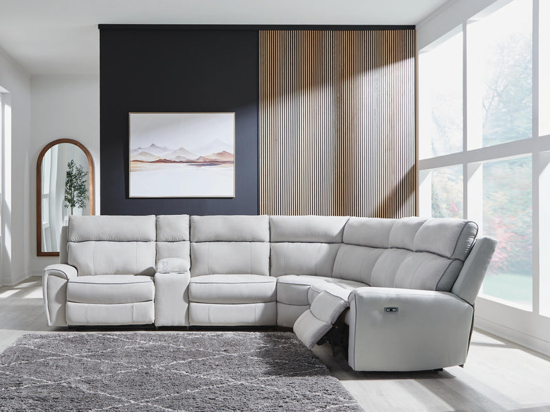 Ashley Furniture Social Pointe reclining sectional with storage console, showing plush fabric, reclining seats, and built-in storage.