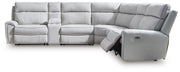 Ashley Furniture Social Pointe reclining sectional with storage console, featuring plush cushions and a modern design in a home setting.