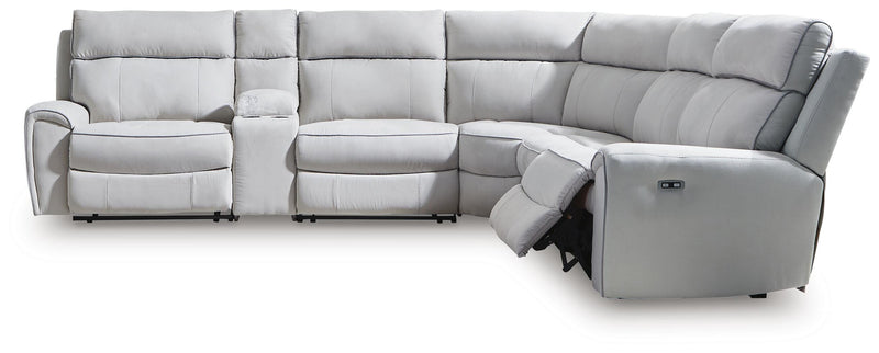 Ashley Furniture Social Pointe reclining sectional with storage console, featuring plush cushions and a modern design in a home setting.