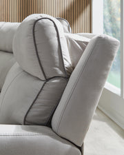 Ashley Furniture Social Pointe reclining sectional with storage console, showing plush fabric, reclining seats, and built-in storage.