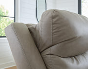 Ashley Furniture Narwhal Place reclining sectional loveseat with plush cushions and a modern design, shown in a cozy living room setting.