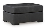 Ashley Furniture Brindley Pier Living Room Set with sofa and armchair, upholstered in neutral fabric, modern design.