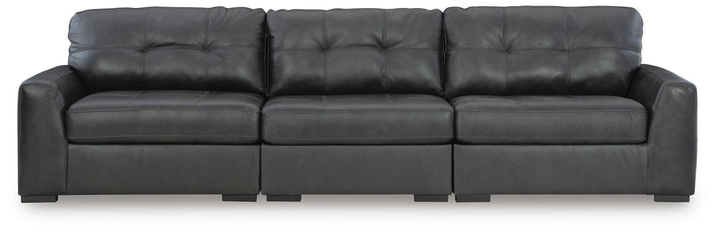 Ashley Furniture Brindley Pier living room set with sofa, loveseat, and armchair in a cozy, stylish living space.