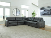 Ashley Furniture Brindley sectional sofa with plush cushions and fabric upholstery, shown in a cozy living room setting.