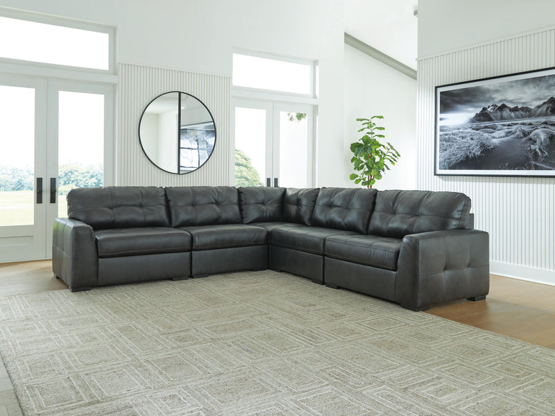 Ashley Furniture Brindley sectional sofa with plush cushions and fabric upholstery, shown in a cozy living room setting.