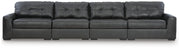 Ashley Furniture Brindley sectional sofa with beige upholstery, featuring plush cushions and a modern design.