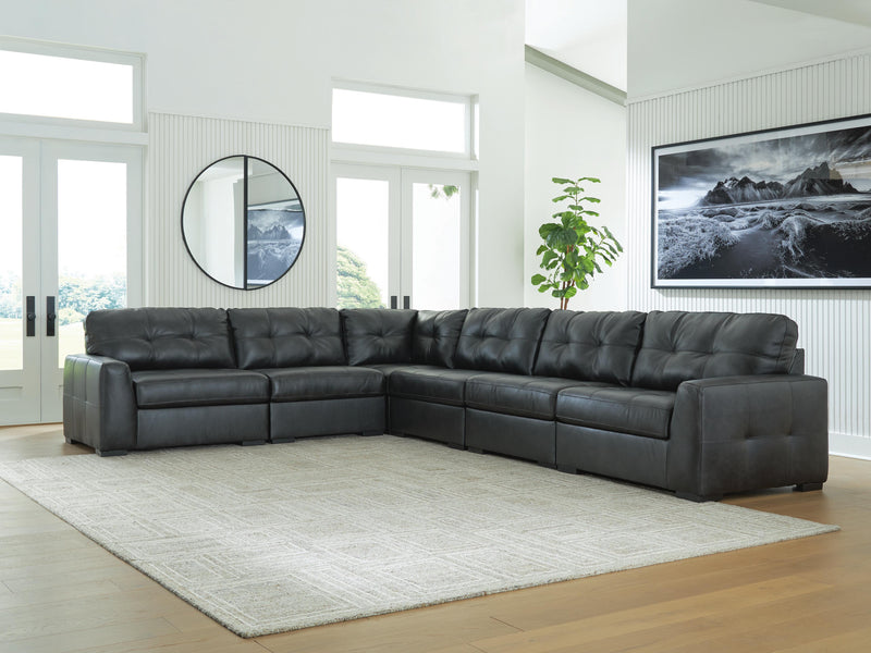 Ashley Furniture Brindley sectional sofa section with plush cushions and fabric upholstery, shown in a modern living room setting.