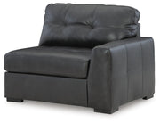 Ashley Furniture Brindley Pier living room set showing sofa and armchair with neutral upholstery in a modern living space.