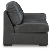 Ashley Furniture Brindley Pier living room set featuring a sofa and armchair with neutral upholstery and wooden legs.