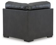 Ashley Furniture Brindley sectional sofa with plush cushions and neutral fabric, shown from the back in a modern living room setting.