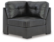 Ashley Furniture Brindley sectional with plush cushions and fabric upholstery, shown from a head-on perspective.