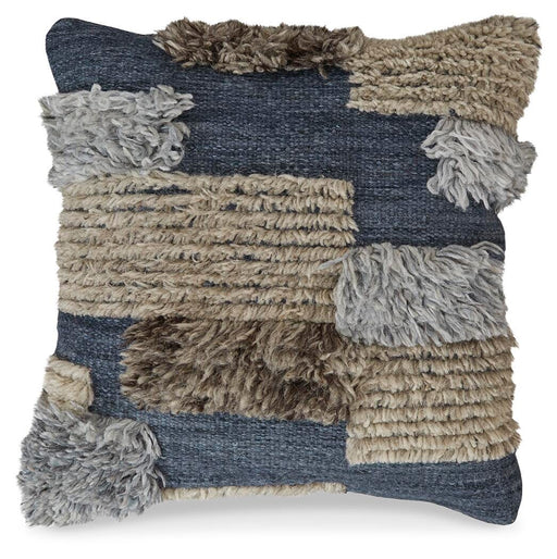 Gibbend Pillow by Ashley Furniture featuring a soft, plush fabric and decorative design, perfect for enhancing bedroom decor.