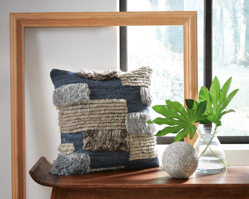 Ashley Furniture Gibbend Pillow with textured fabric and decorative design, perfect for adding style to your living space.
