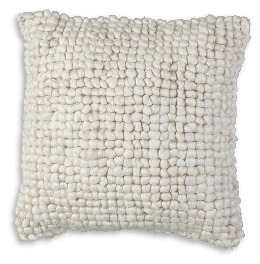 Ashley Furniture Aavie Pillow showing plush fabric and decorative stitching on a stylish bedroom pillow.