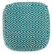 Ashley Furniture Brynnsen pouf with soft fabric upholstery and modern design, shown from the top view.