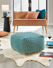 Ashley Furniture Brynnsen pouf, woven fabric ottoman with wooden legs, versatile accent piece for living room or bedroom decor.