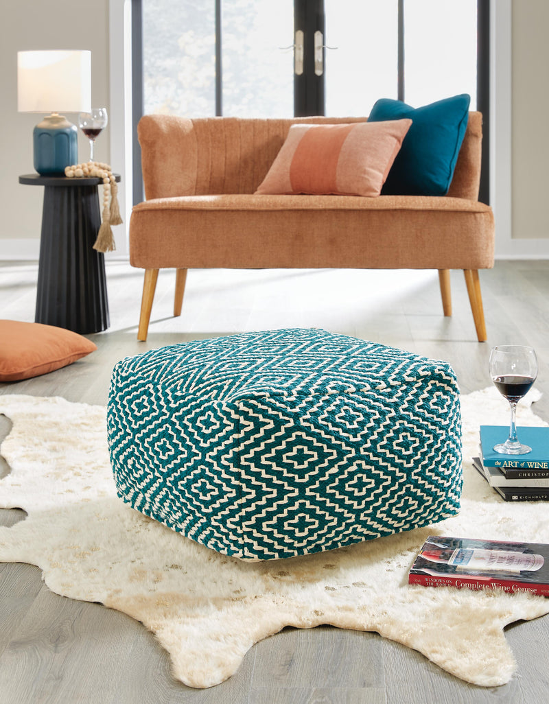 Ashley Furniture Brynnsen pouf, woven fabric ottoman with wooden legs, versatile accent piece for living room or bedroom decor.