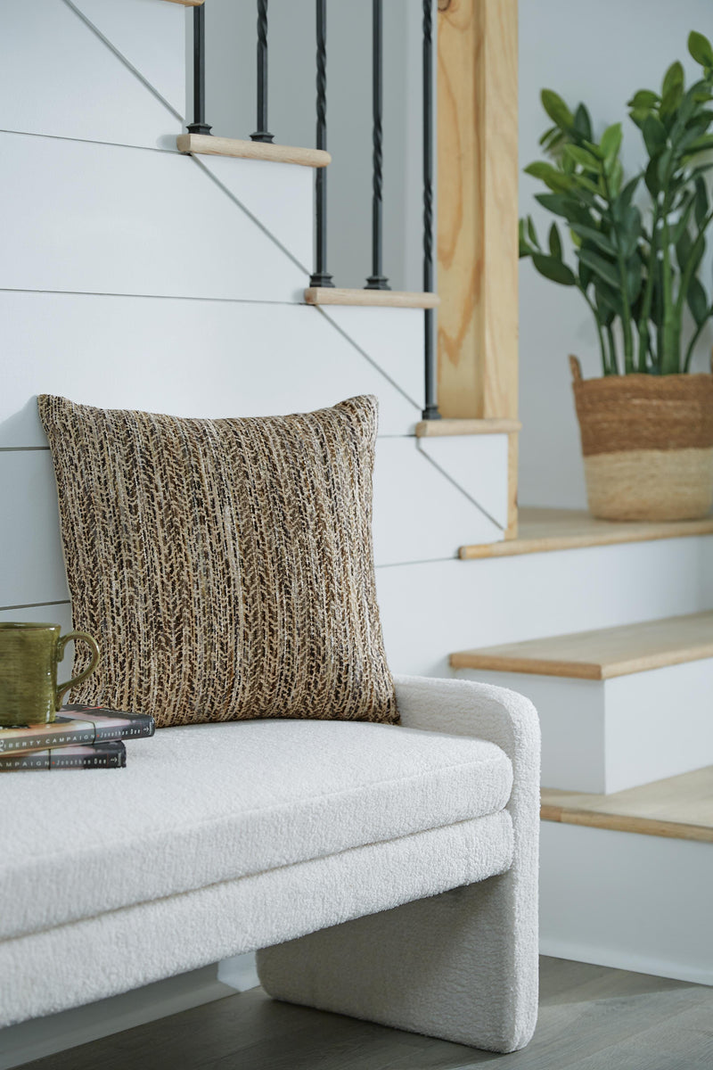 Set of four Ashley Furniture Jayner pillows with soft fabric covers and decorative stitching, perfect for bedroom or living room decor.