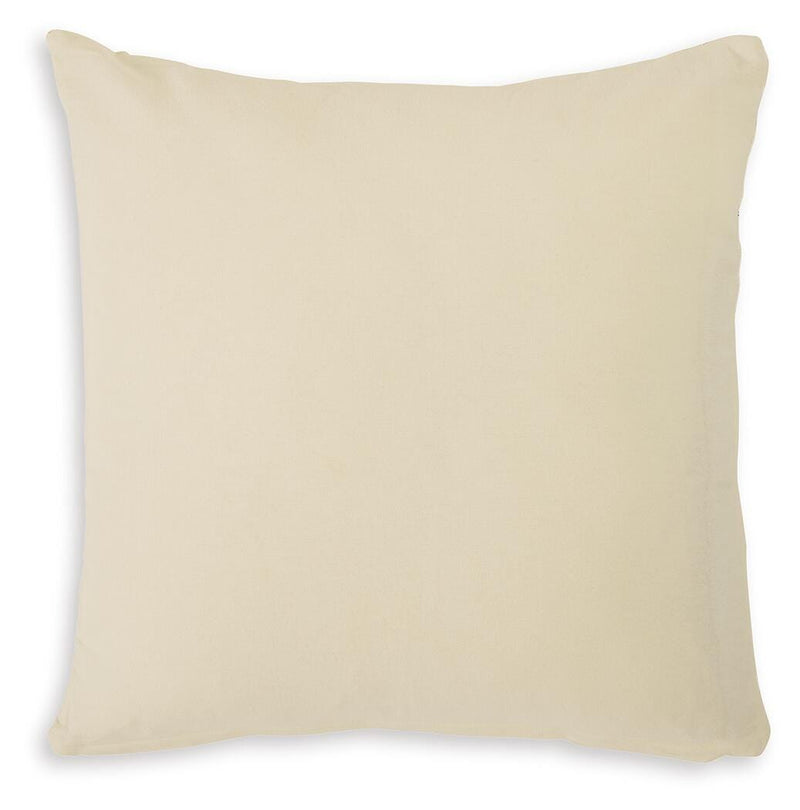 Set of four Ashley Furniture Kydner pillows with neutral fabric covers, displayed in a cozy living room setting.