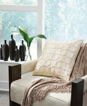 Set of four Ashley Furniture Kydner pillows with decorative patterns and plush fabric, ideal for adding comfort and style to living spaces.
