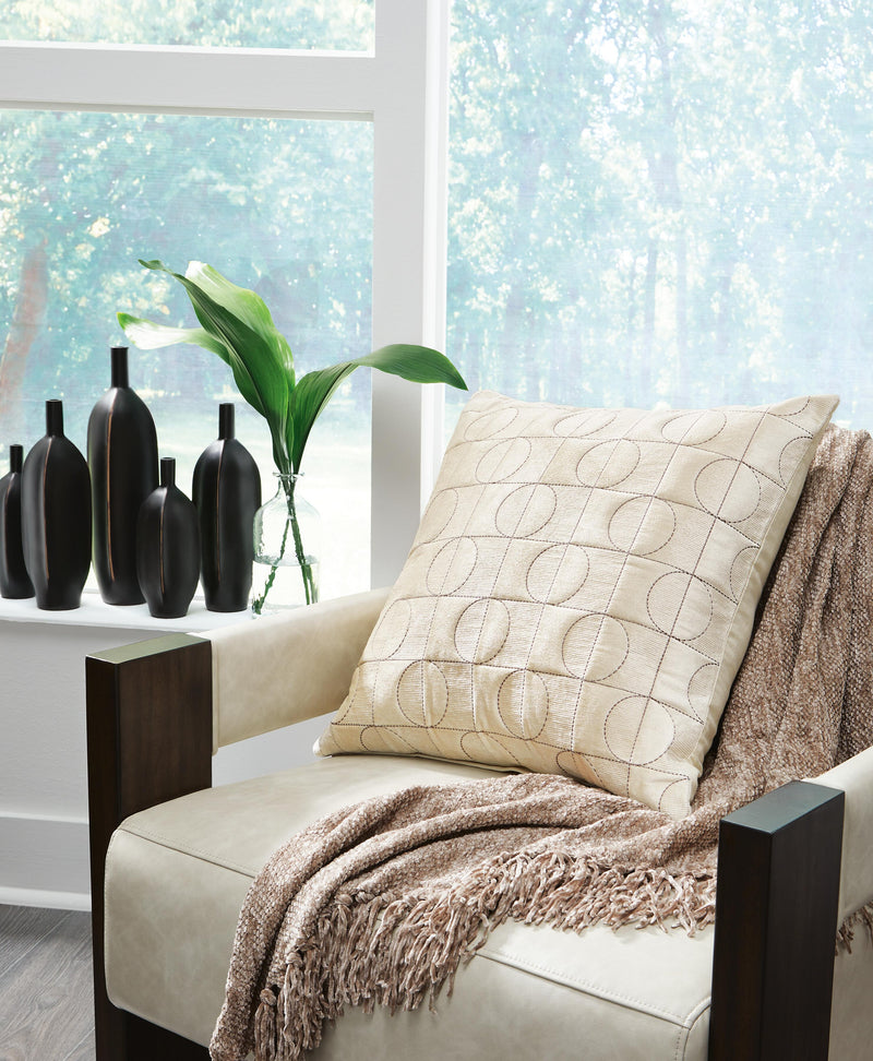 Set of four Ashley Furniture Kydner pillows with decorative patterns and plush fabric, ideal for adding comfort and style to living spaces.