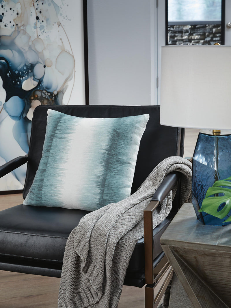 Set of four Ashley Furniture Elonwich pillows featuring soft fabric and decorative patterns for cozy home decor.