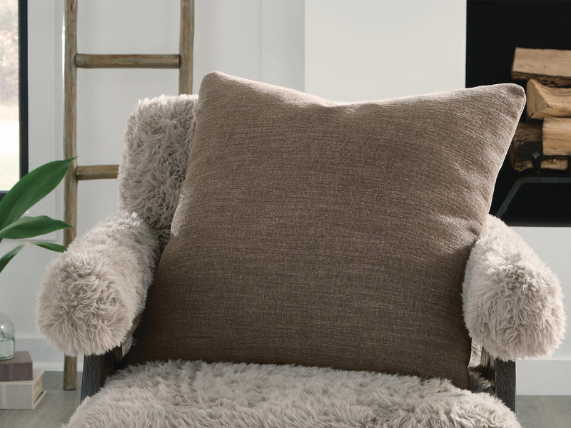 Set of four Ashley Furniture Brockbert pillows with decorative fabric covers, perfect for living room or bedroom decor.