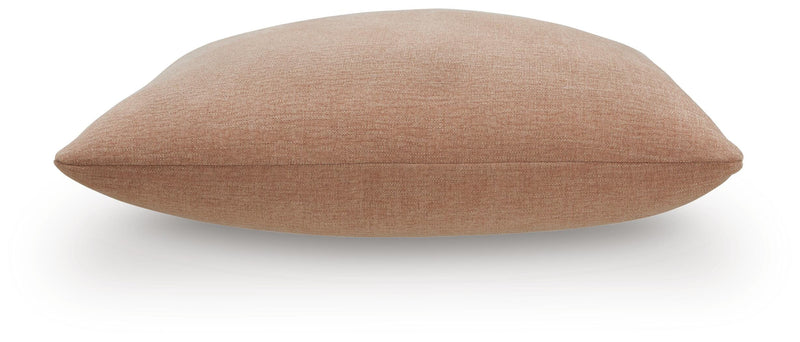 Set of four Ashley Furniture Brockbert pillows with soft fabric covers and decorative patterns arranged together.